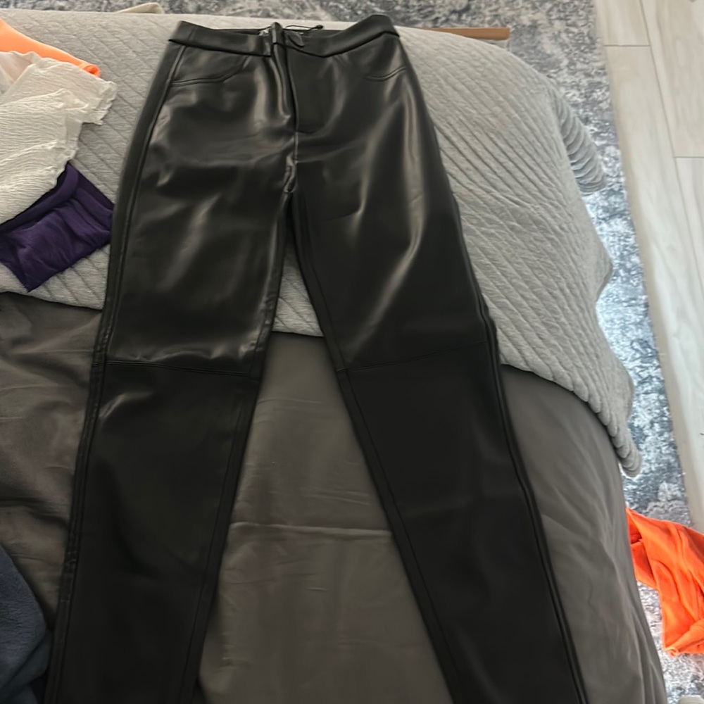 Black leather pants. They have never been worn. Size xs